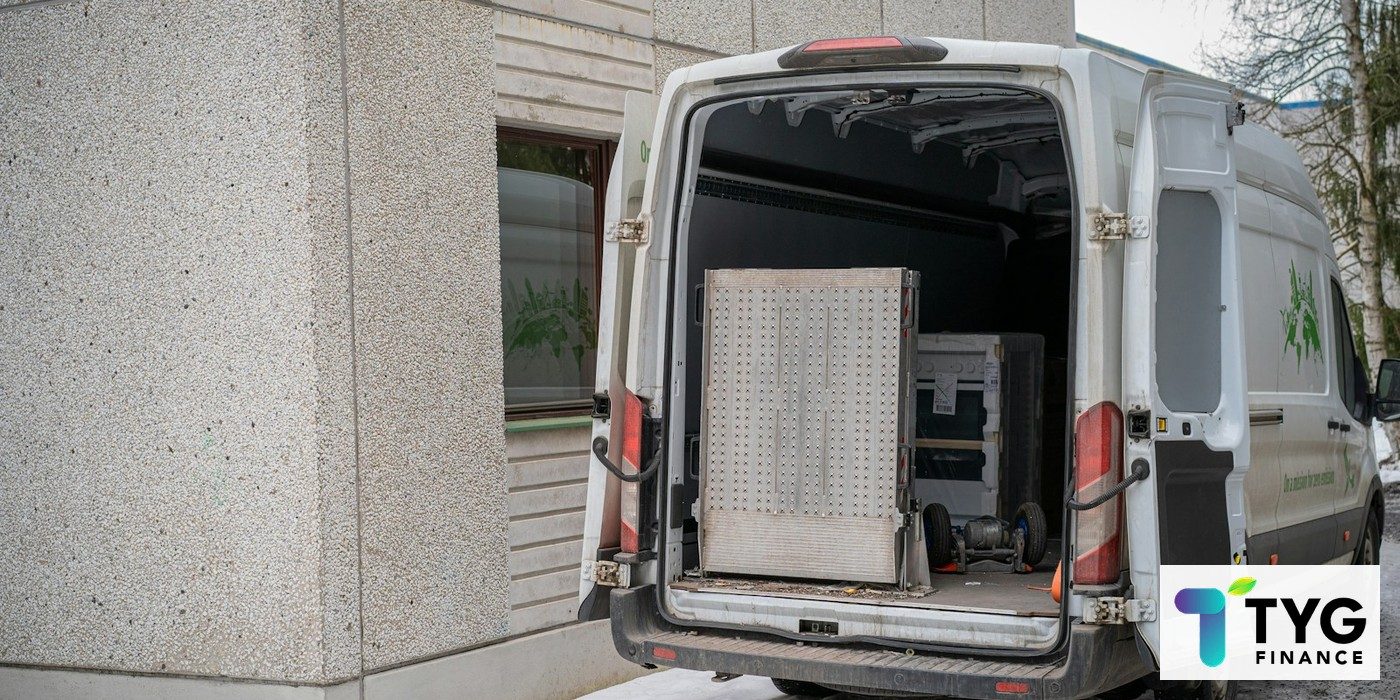 White commercial delivery van with rear doors open, showcasing professional trade vehicle setup